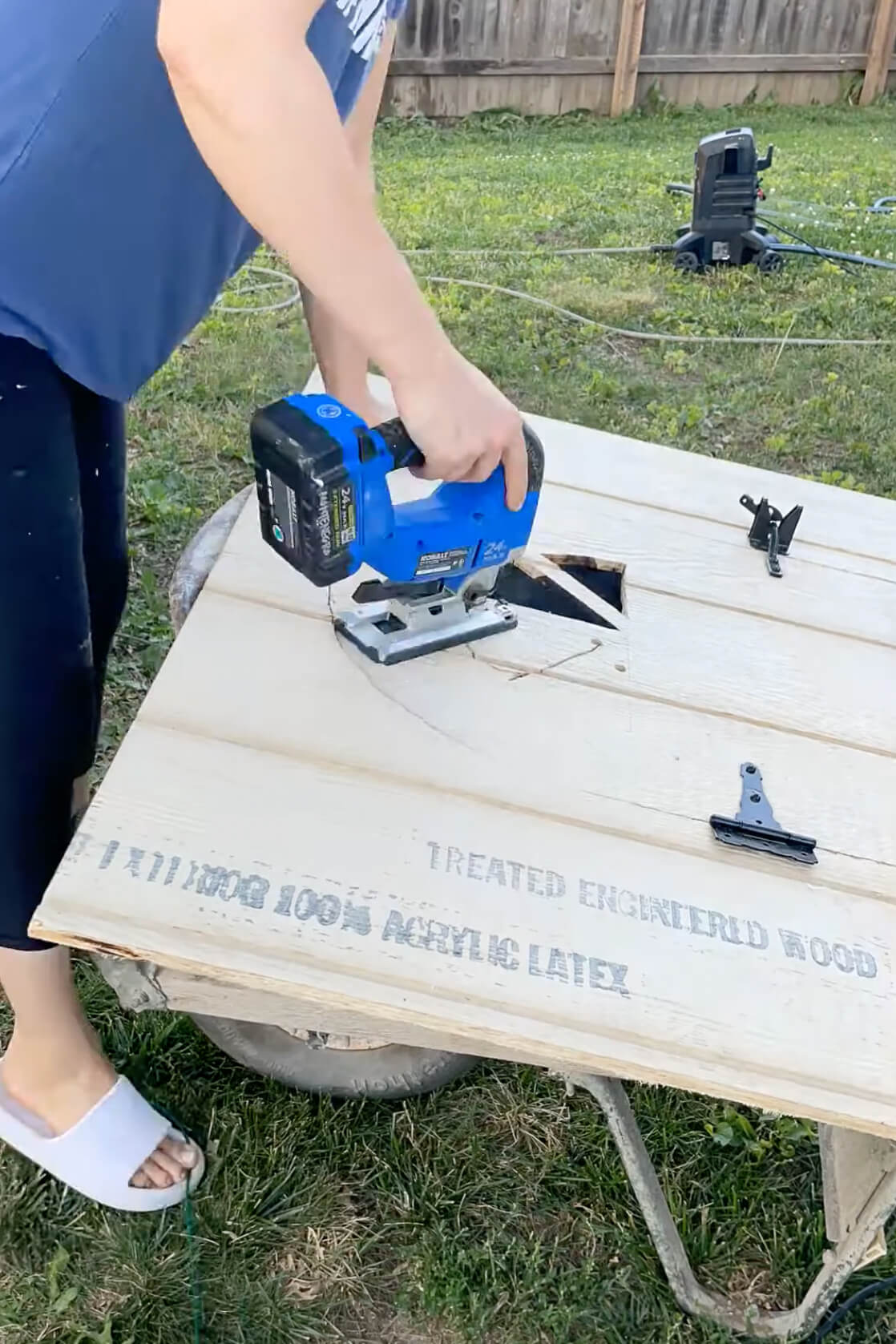 Using a drill to start a hole for a jig saw.